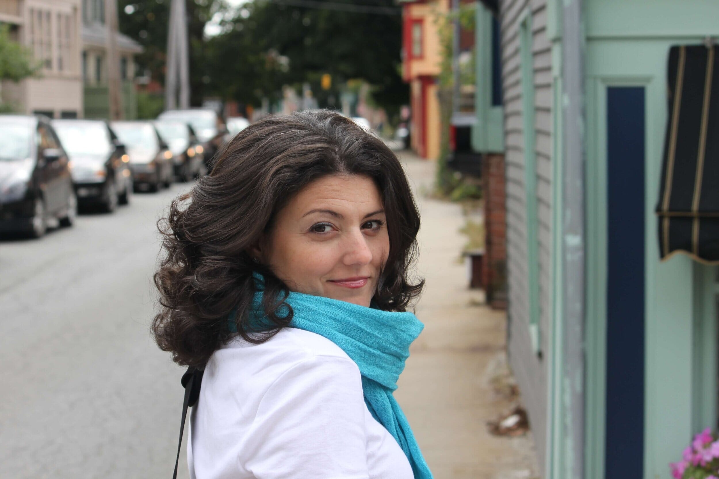 middle-aged woman walking down a city block