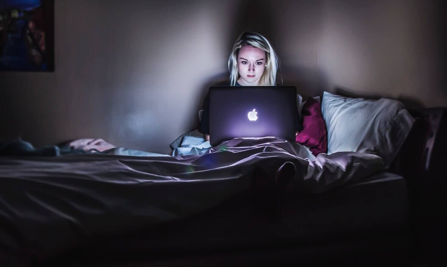 woman researching fertility clinics on her laptop