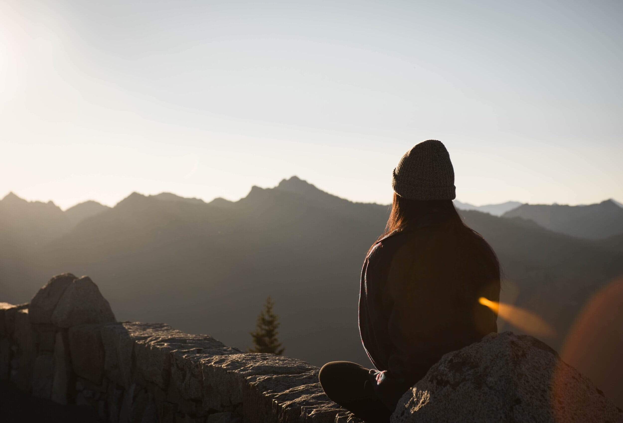 woman looking out at mountainous landscape