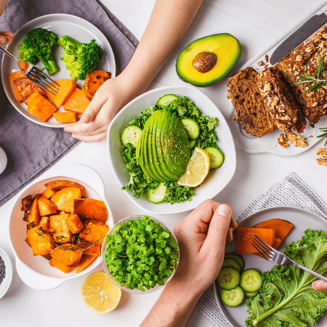 table full of healthy vegetables and baked bread