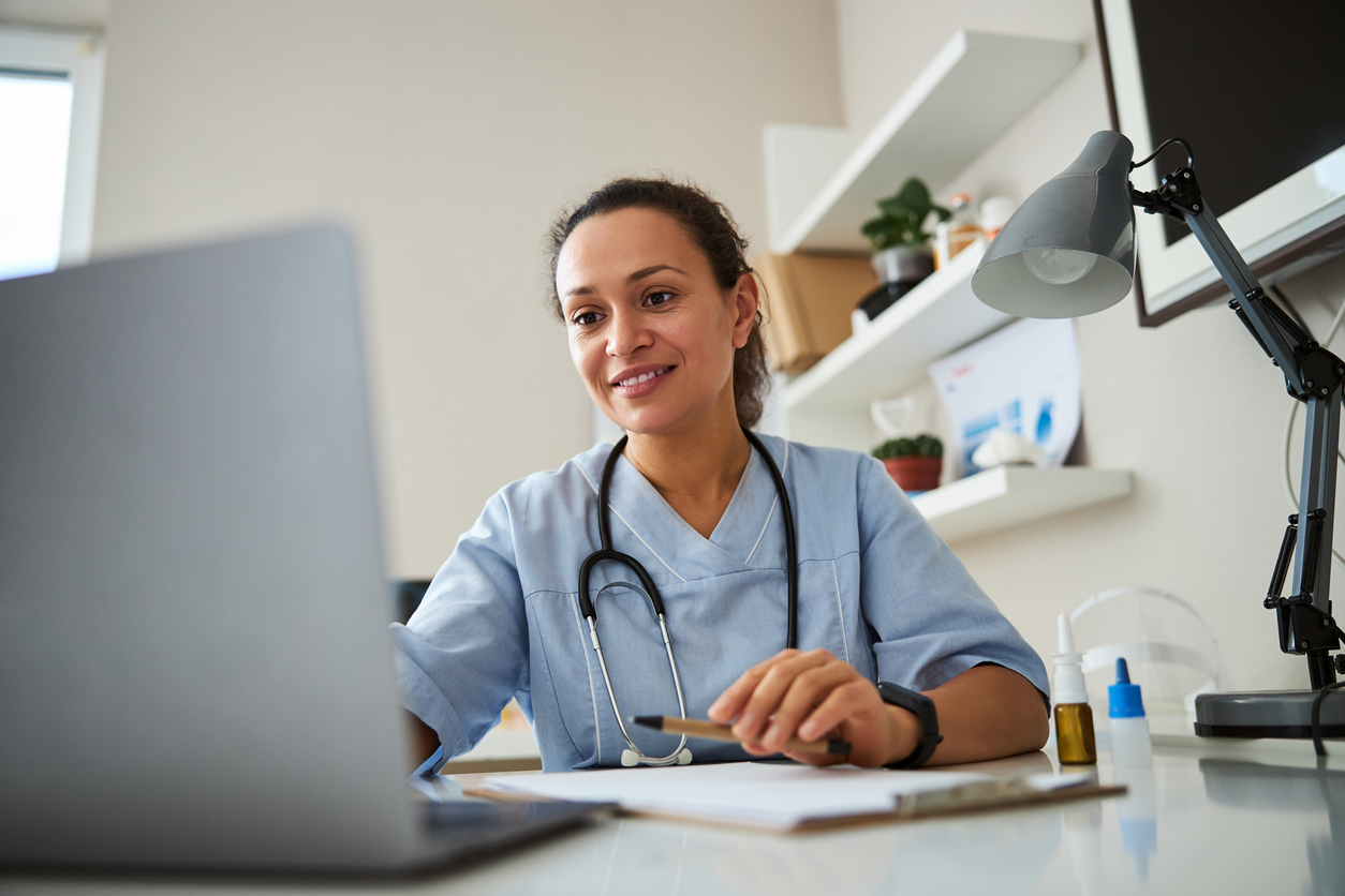 fertility specialist looking at her computer