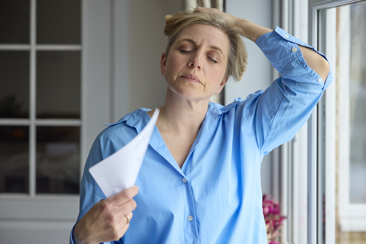 middle aged woman having a hot flash