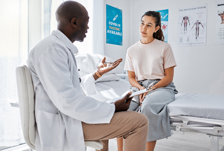 woman discussing egg donation with a doctor