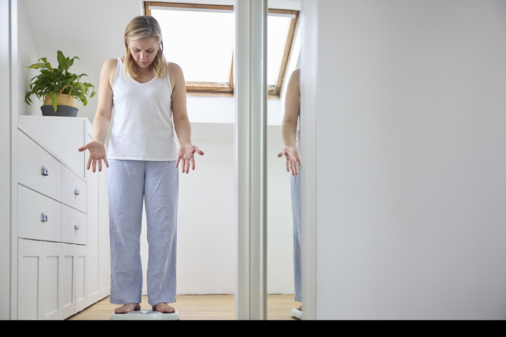 woman struggling with menopausal weight gain