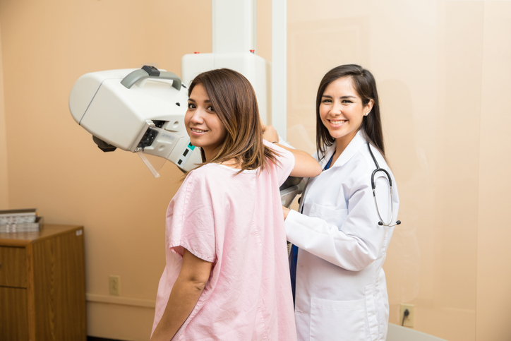 mammography technologist with a patient
