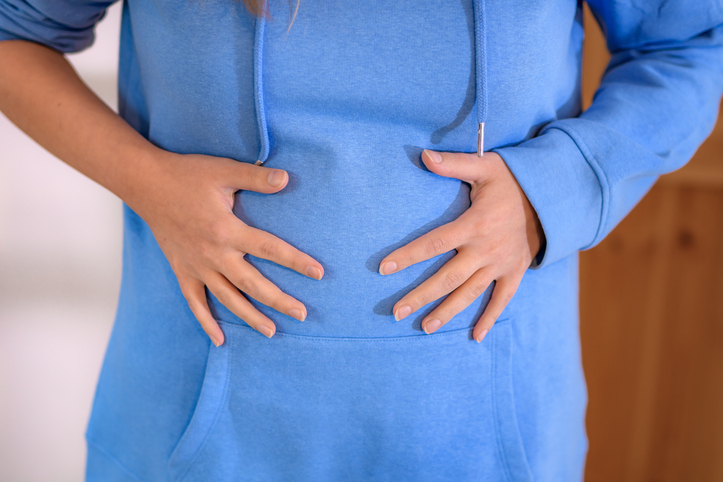woman trying to relieve bloating during period