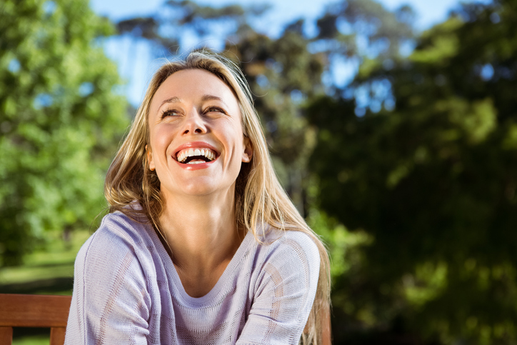 healthy woman smiling outdoors
