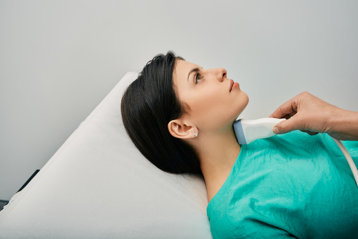 woman having ultrasound imaging on her thyroid