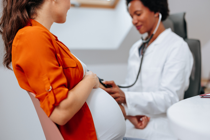 pregnant woman getting prenatal care