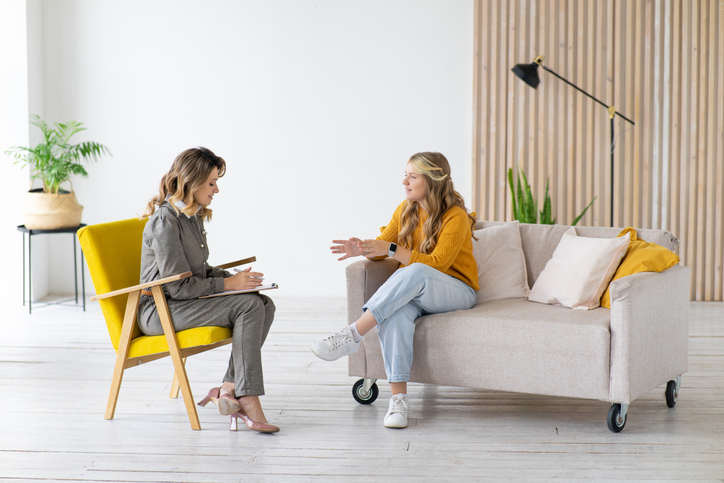 woman speeking with a counselor