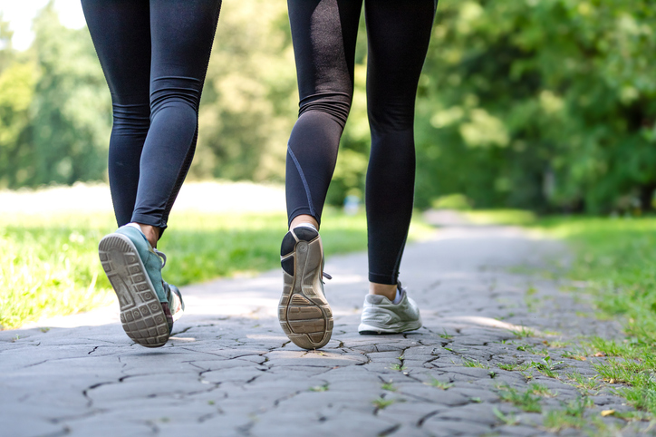 two women walking outdoors