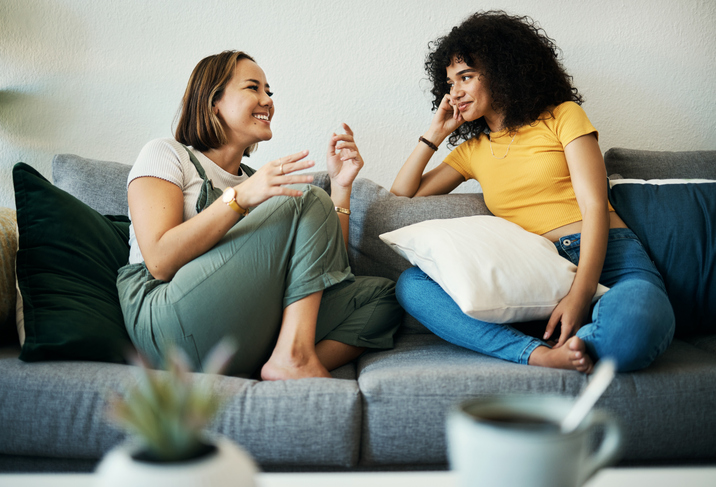 two women comparing headache symptoms