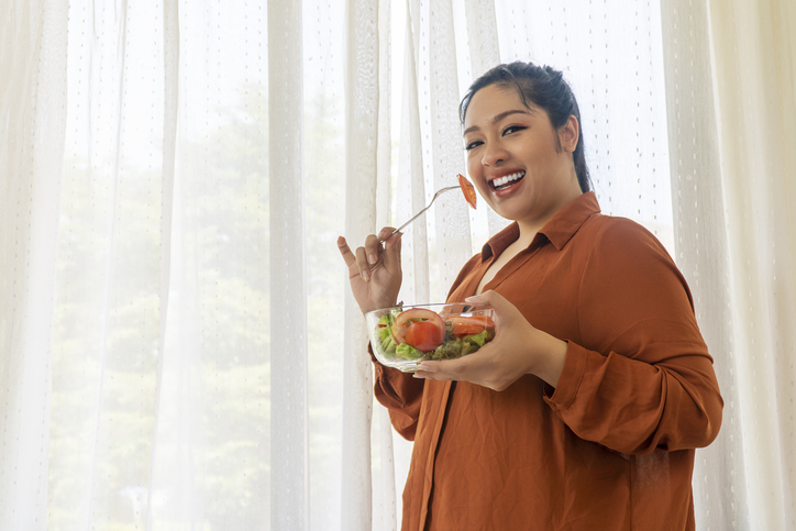 woman eating a salad