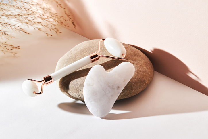 two gua sha products side by side