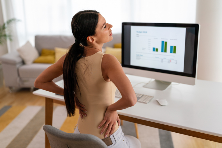 woman struggling with period pain at work