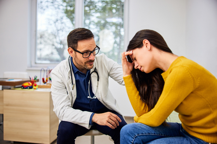 frustrated woman meeting with doctor