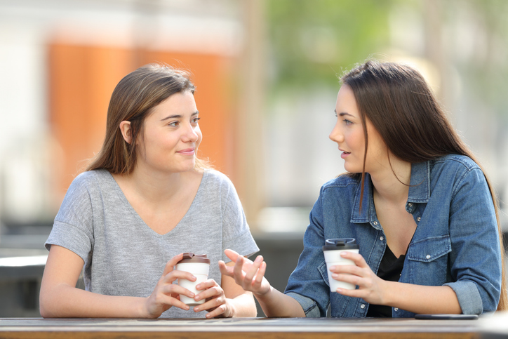two women talking about endometriosis tests over coffee