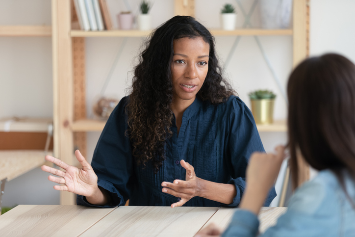 financial counselor working with a client on budgeting to freeze eggs