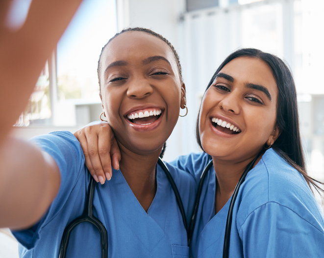 two women doctors taking a selfie