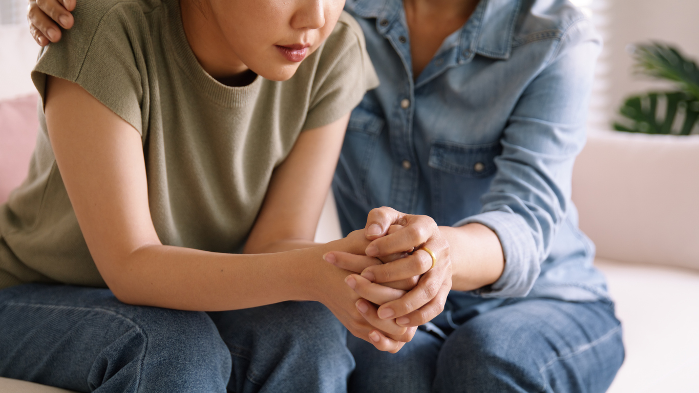 partner comforting his partner after a missed miscarriage