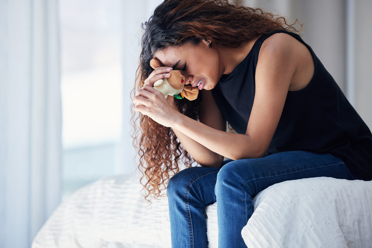 woman experiencing the devastation of recurrent pregnancy loss or RPL