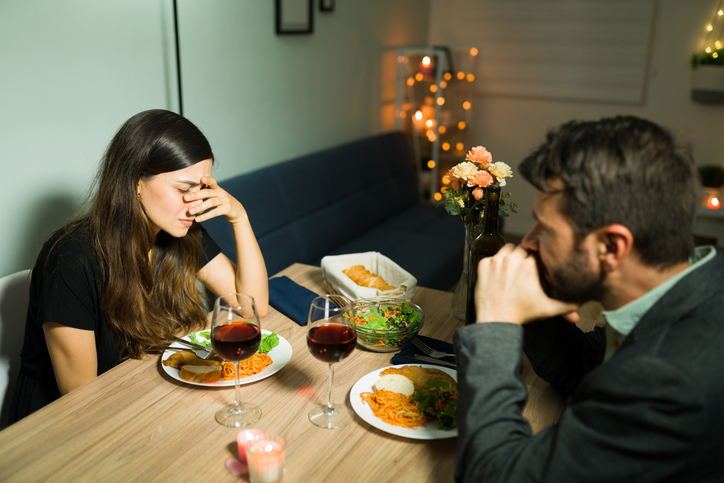 woman out to dinner feeling the need to poop
