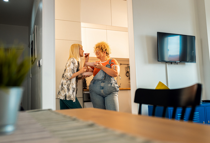 woman feeding her partner