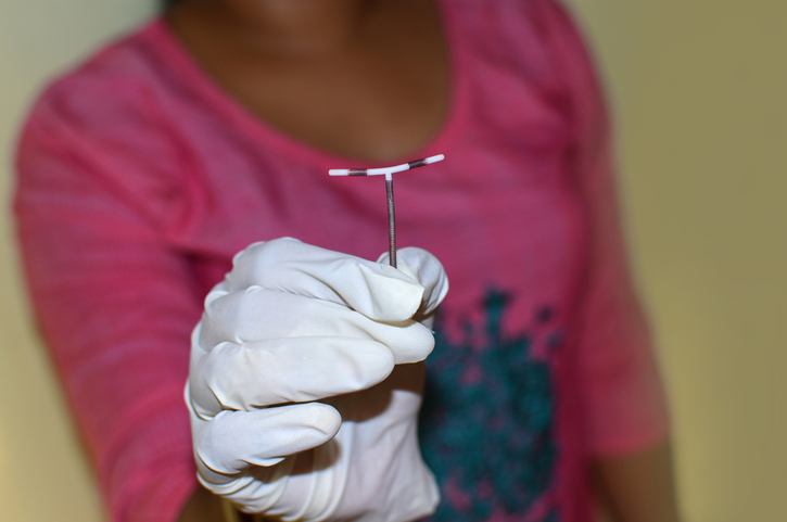 woman holding an iud