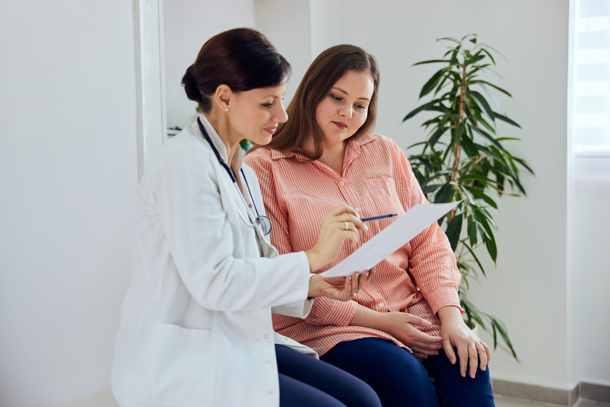 woman discussing pcos treatment options with her doctor
