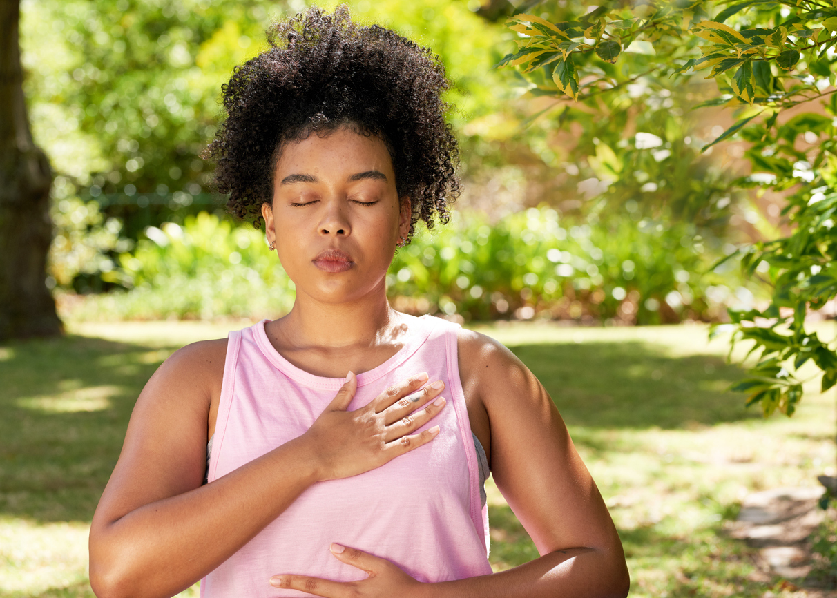 woman with pcos taking deep breaths outdoors