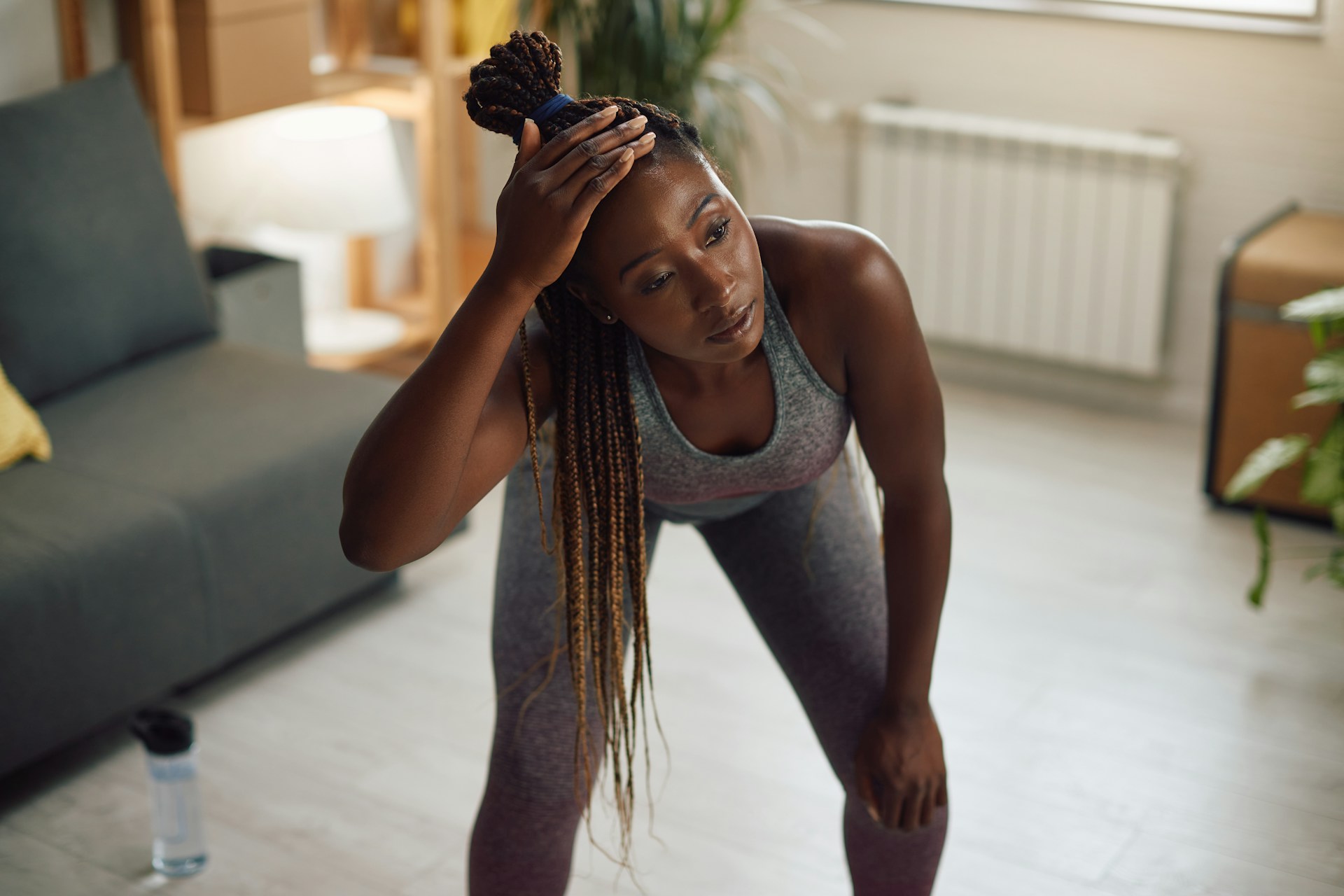 woman pausing in the middle of a workout