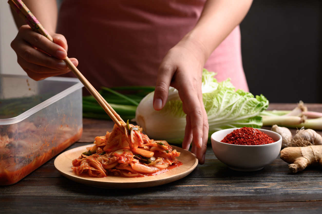 woman with recurrent yeast infections eating kimchi
