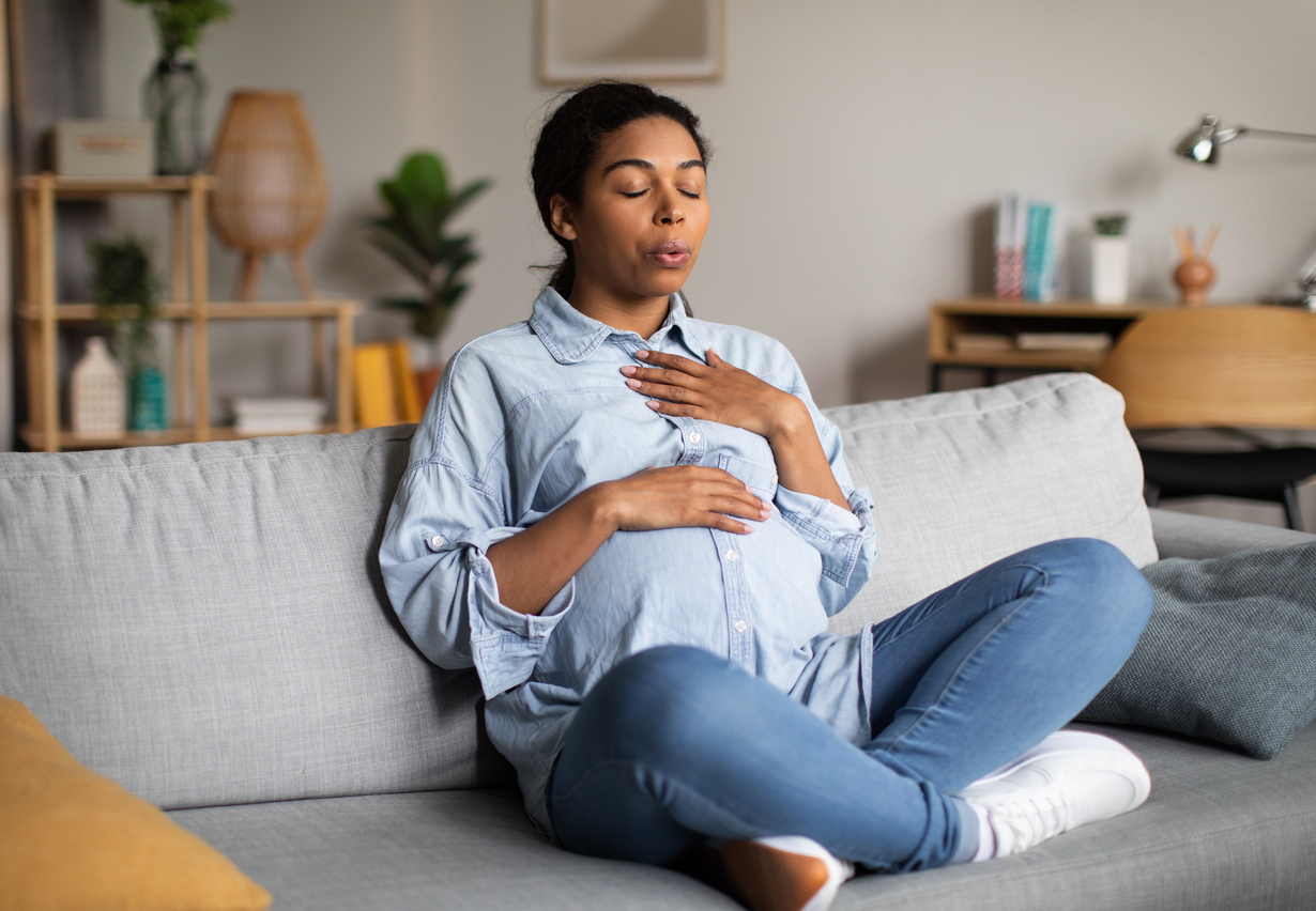 pregnant woman calming her cough