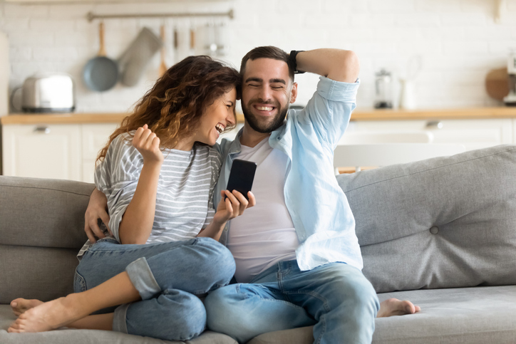 couple cuddling on the sofa