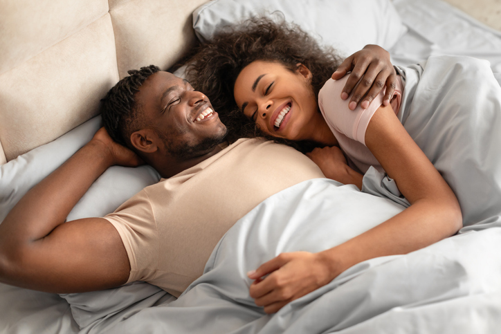 happy couple in bed