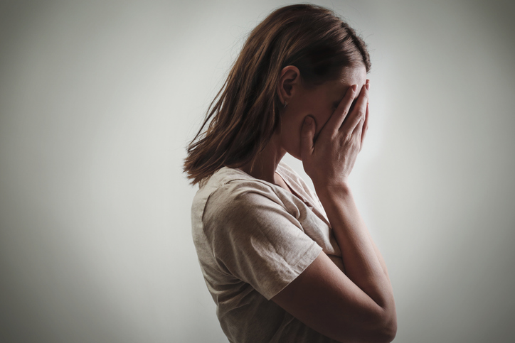 woman crying due to progesterone induced anxiety