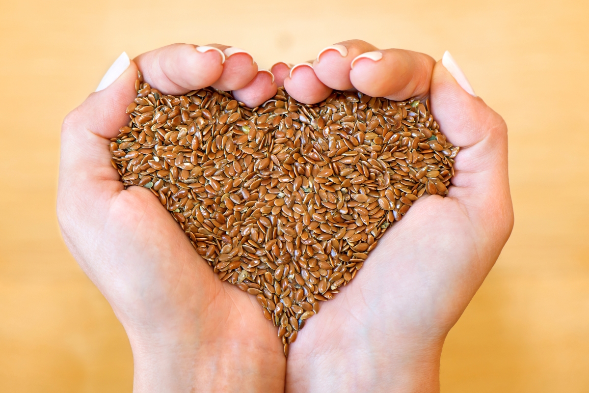 woman holding a large handful of raw seeds