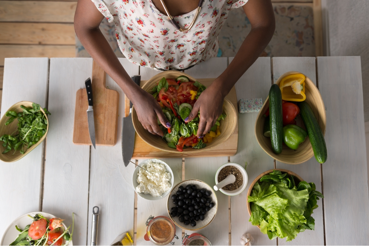 woman incorporating seeds into her salad