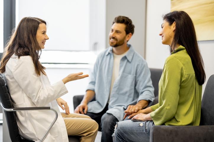 fertility specialist discussing ivf twins with a couple
