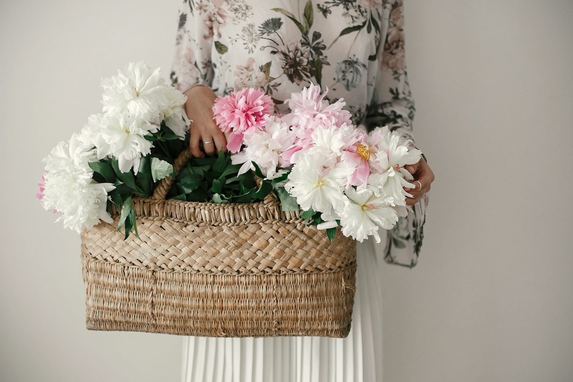 woman carrying a basket of flowers