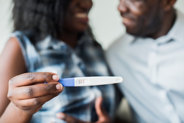 couple with a positive pregnancy test