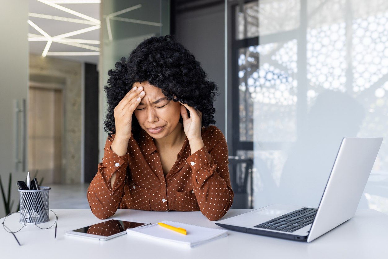 woman having a splitting headache