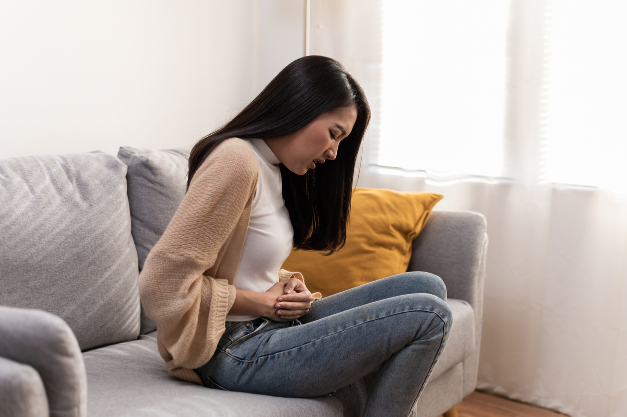 woman struggling with menstrual cramps