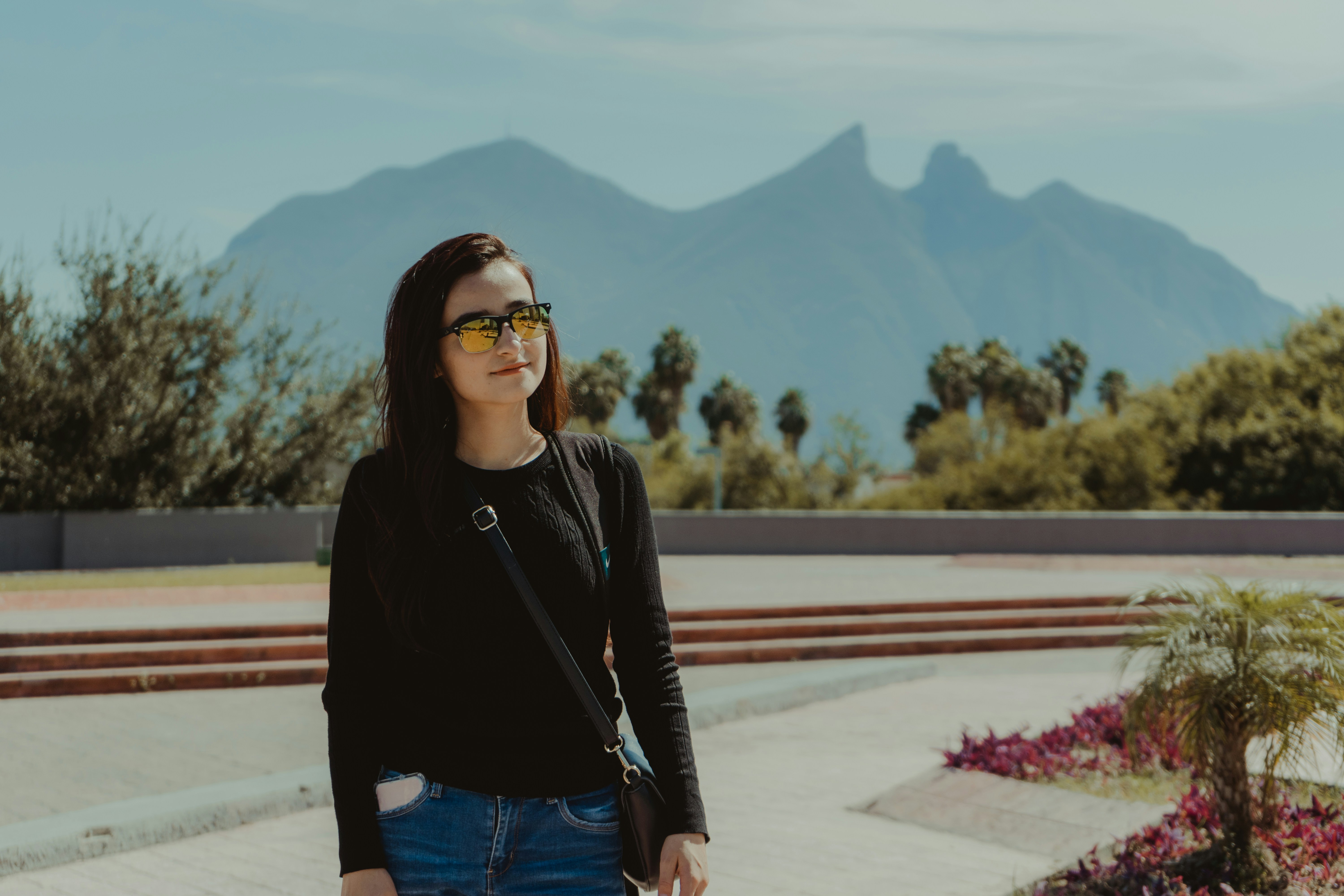 young woman wearing sunglasses outdoors