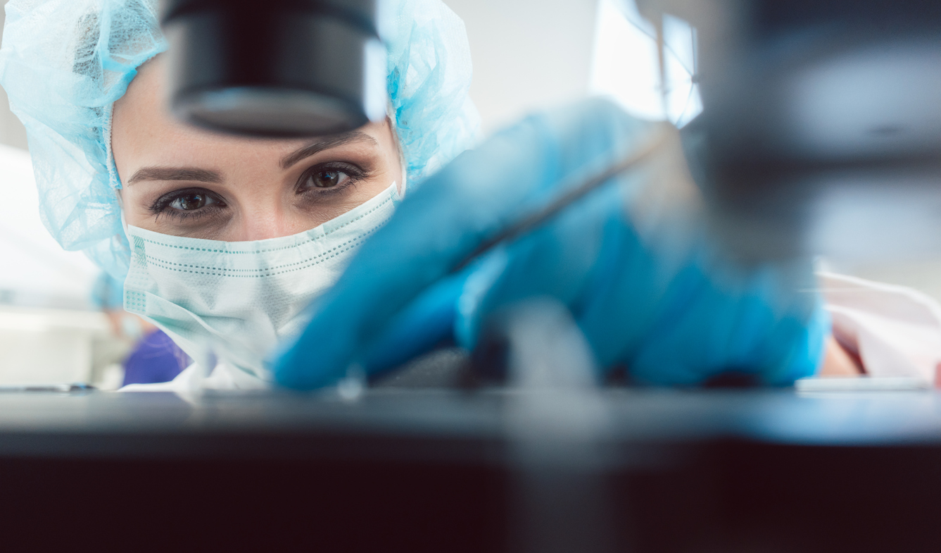 embryologist doing assisted hatching ivf
