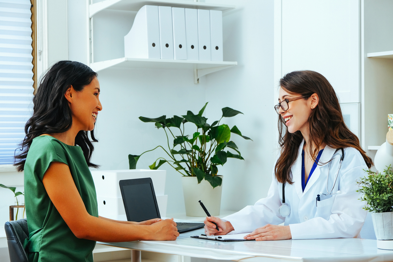 woman discussing assisted hatching ivf with her rei