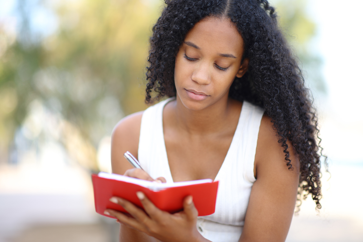 woman journaling to treat her ptsd