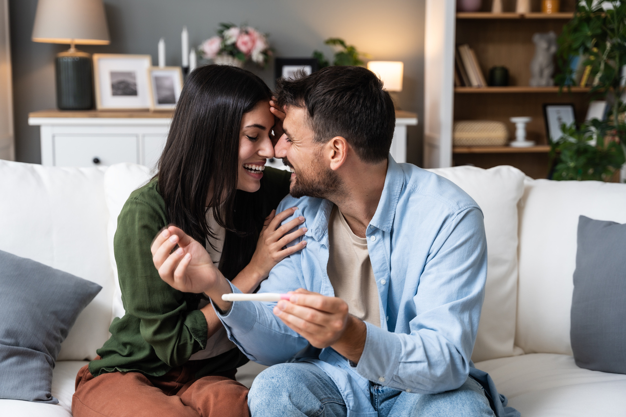 couple excited about a positive pregnancy test