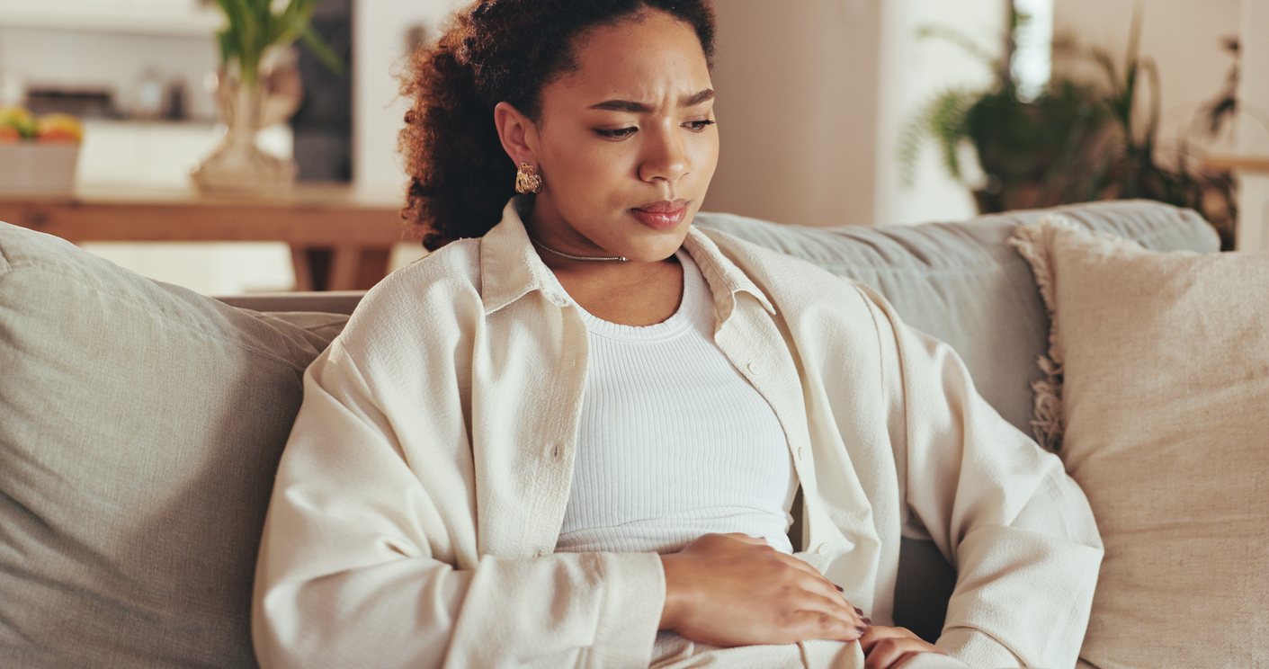 woman feeling protective of herself in early pregnancy