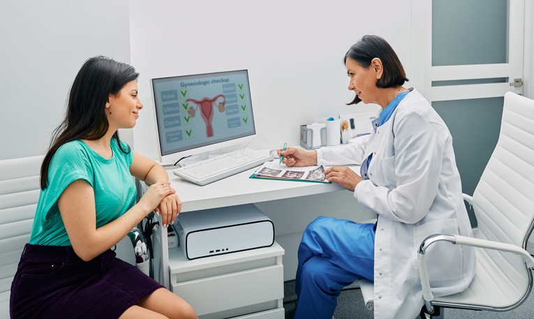 woman discussing secondary infertility with her doctor